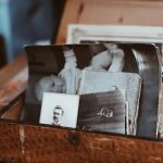 old photos in brown wooden chest