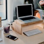 silver MacBook on desk