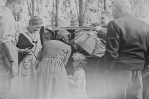 vintage photo of person getting on a car